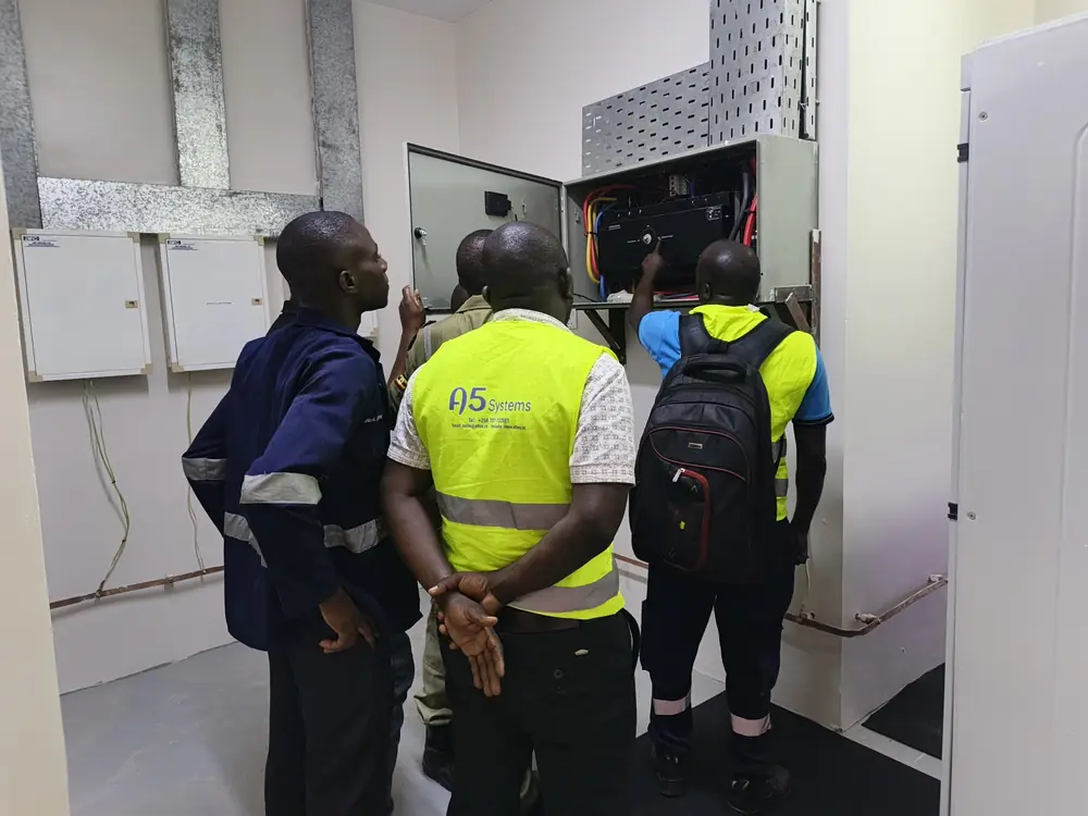 A5 Systems team inspecting an electrical cabinet on site