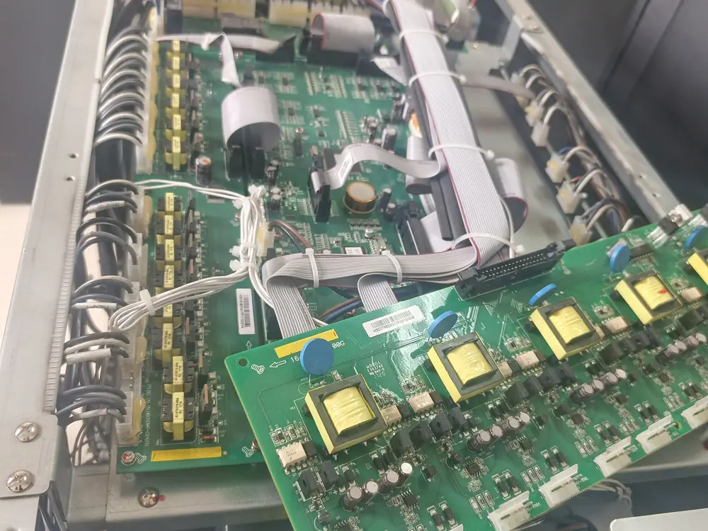 Open UPS cabinet showing power and control boards